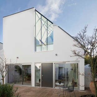 Design ideas for a medium sized and white contemporary two floor detached house in London.