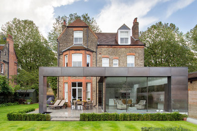 Photo of a large contemporary house exterior in London with three floors.