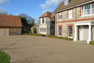 Design ideas for a large traditional house exterior in Sussex.