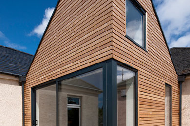 Design ideas for a contemporary house exterior in Edinburgh.