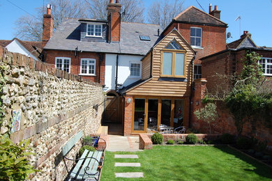 Design ideas for a contemporary house exterior in Surrey.