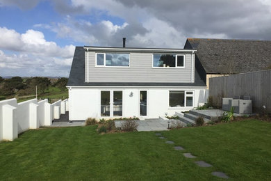 Design ideas for a beige coastal two floor house exterior in Cornwall with mixed cladding.