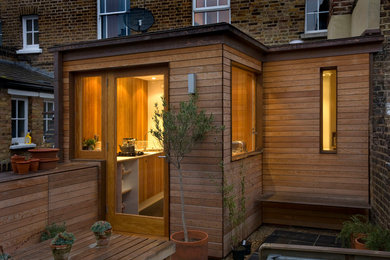 Contemporary house exterior in London with wood cladding.