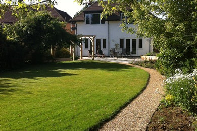 Design ideas for a medium sized farmhouse house exterior in Surrey.