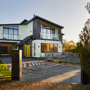 Design ideas for a multi-coloured contemporary two floor detached house in Essex with a lean-to roof, mixed cladding and a metal roof.