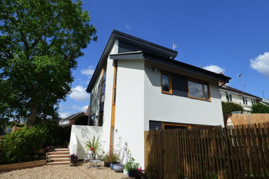This is an example of a small contemporary house exterior in Buckinghamshire.