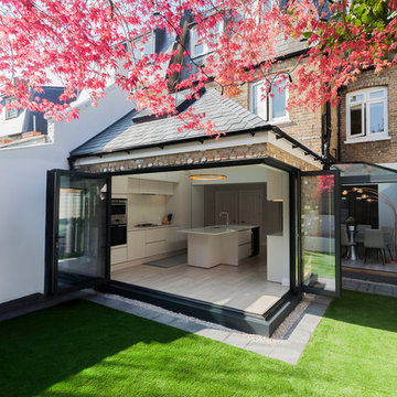 Modern glazed extension with open pitched roof and skylight