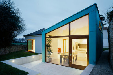 Multi-coloured contemporary house exterior in Dublin with metal cladding and a pitched roof.