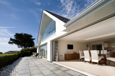 Design ideas for a modern house exterior in Channel Islands.