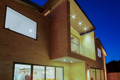 This is an example of a large contemporary house exterior in Cambridgeshire.