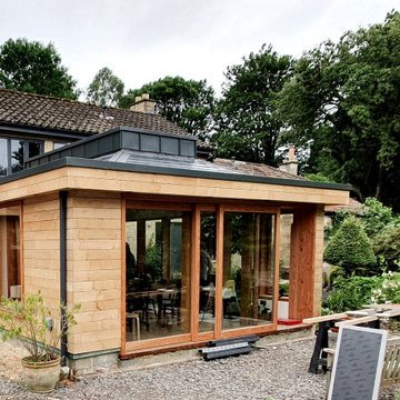 New douglas-fir-framed extension in award-winning gardens