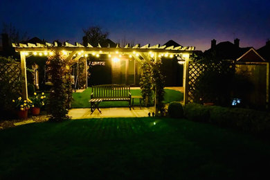 Night time view of a summer room with garden lights