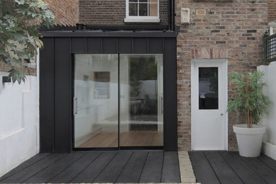 This is an example of a small house exterior in London with metal cladding.