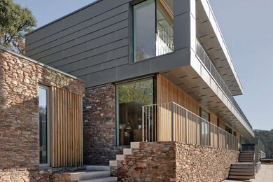 Design ideas for a modern house exterior in Devon.