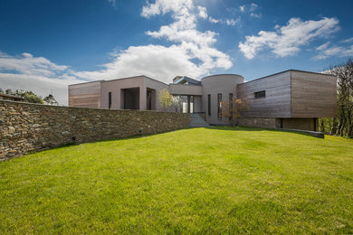 This is an example of a large contemporary two floor house exterior in Devon.