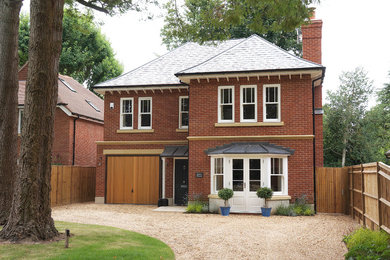 Design ideas for a medium sized traditional two floor brick house exterior in Wiltshire.