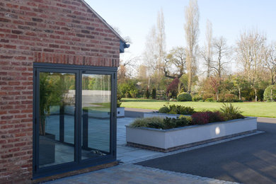 Design ideas for a contemporary house exterior in Cheshire.