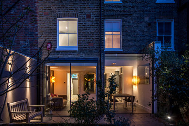 Contemporary glass house exterior in London with three floors.