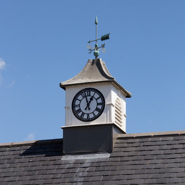 Roof lantern with clock and weather vane