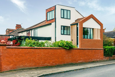 Design ideas for a contemporary house exterior in Manchester.