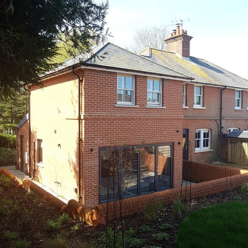 Semi-detached house two storey side extension, basement and garage.