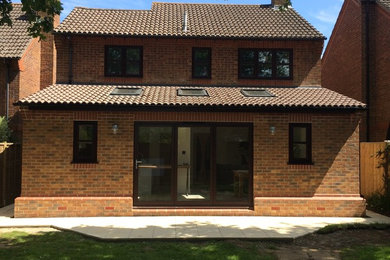 Medium sized contemporary bungalow brick house exterior in Dorset.