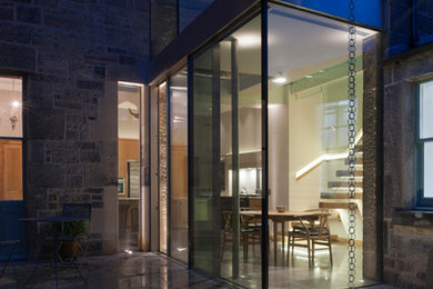 Inspiration för moderna hus, med glasfasad och platt tak