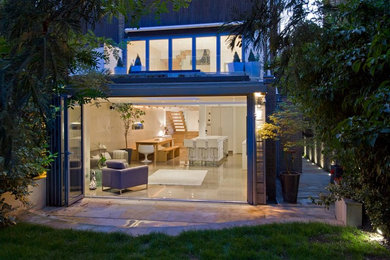 Modern two floor house exterior in London with metal cladding.