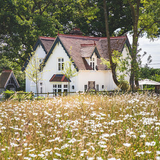 Design ideas for a small and white traditional two floor render house exterior in Berkshire with a pitched roof.