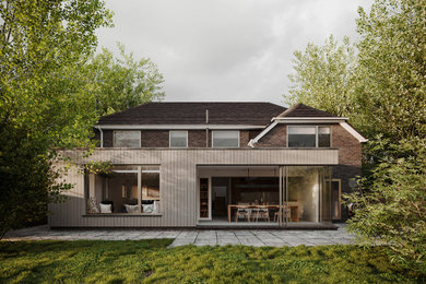 Foto de fachada de casa marrón marinera de tamaño medio de dos plantas con revestimiento de madera