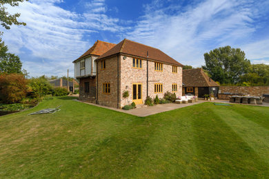 This is an example of a two floor detached house in Kent with a pitched roof.