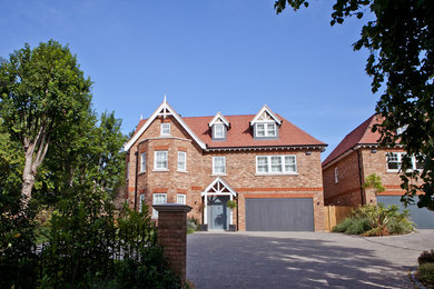 Inspiration for a large contemporary brick detached house in Kent with three floors and a tiled roof.