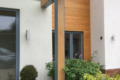 This is an example of a contemporary house exterior in Surrey.