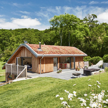 Sustainable family house nestled into surrounding countryside