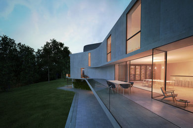 Inspiration for a large and gey contemporary concrete detached house in London with three floors and a flat roof.
