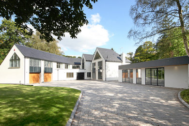 Inspiration for a contemporary house exterior in Surrey.