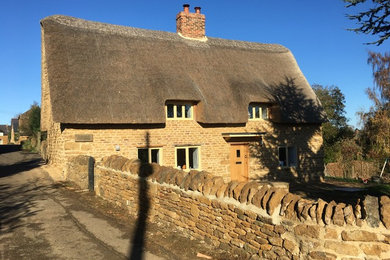 Inspiration for a medium sized traditional two floor detached house in Oxfordshire with stone cladding and a pitched roof.