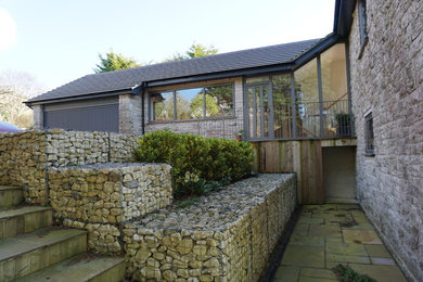 Design ideas for a modern house exterior in Dorset.