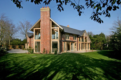 Inspiration for a large and red contemporary two floor brick house exterior in Cheshire.