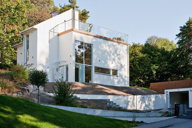 Design ideas for a contemporary house exterior in Stockholm.