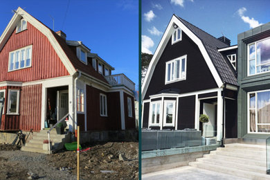 Modelo de fachada de casa negra nórdica de tamaño medio de dos plantas con revestimientos combinados, tejado a doble faldón y tejado de varios materiales