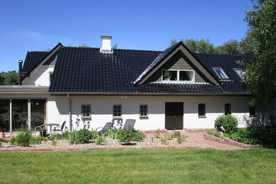 This is an example of a country house exterior in Other.