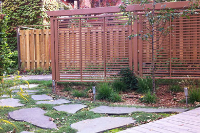 This is an example of a mid-sized transitional backyard landscaping in Montreal.