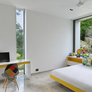 Idée de décoration pour une chambre d'enfant de 4 à 10 ans design avec un mur blanc, béton au sol et un sol gris.