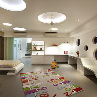 Idées déco pour une chambre d'enfant de 1 à 3 ans contemporaine avec un mur blanc et un sol gris.