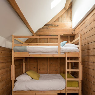 Design ideas for a medium sized rustic gender neutral children’s room in London with medium hardwood flooring and brown floors.