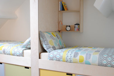 Small scandinavian gender neutral children’s room in Gloucestershire with white walls, grey floors and carpet.