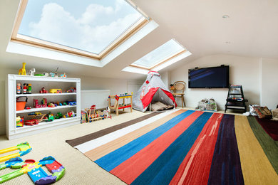 Design ideas for a traditional playroom in London with white walls and carpet.