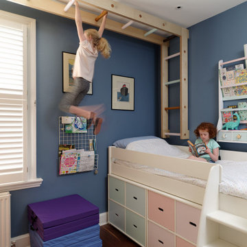 Children's bedroom with climbing wall and monkey bars