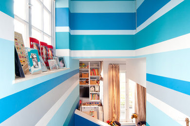 Inspiration for a contemporary kids' bedroom in London with multi-coloured walls.
